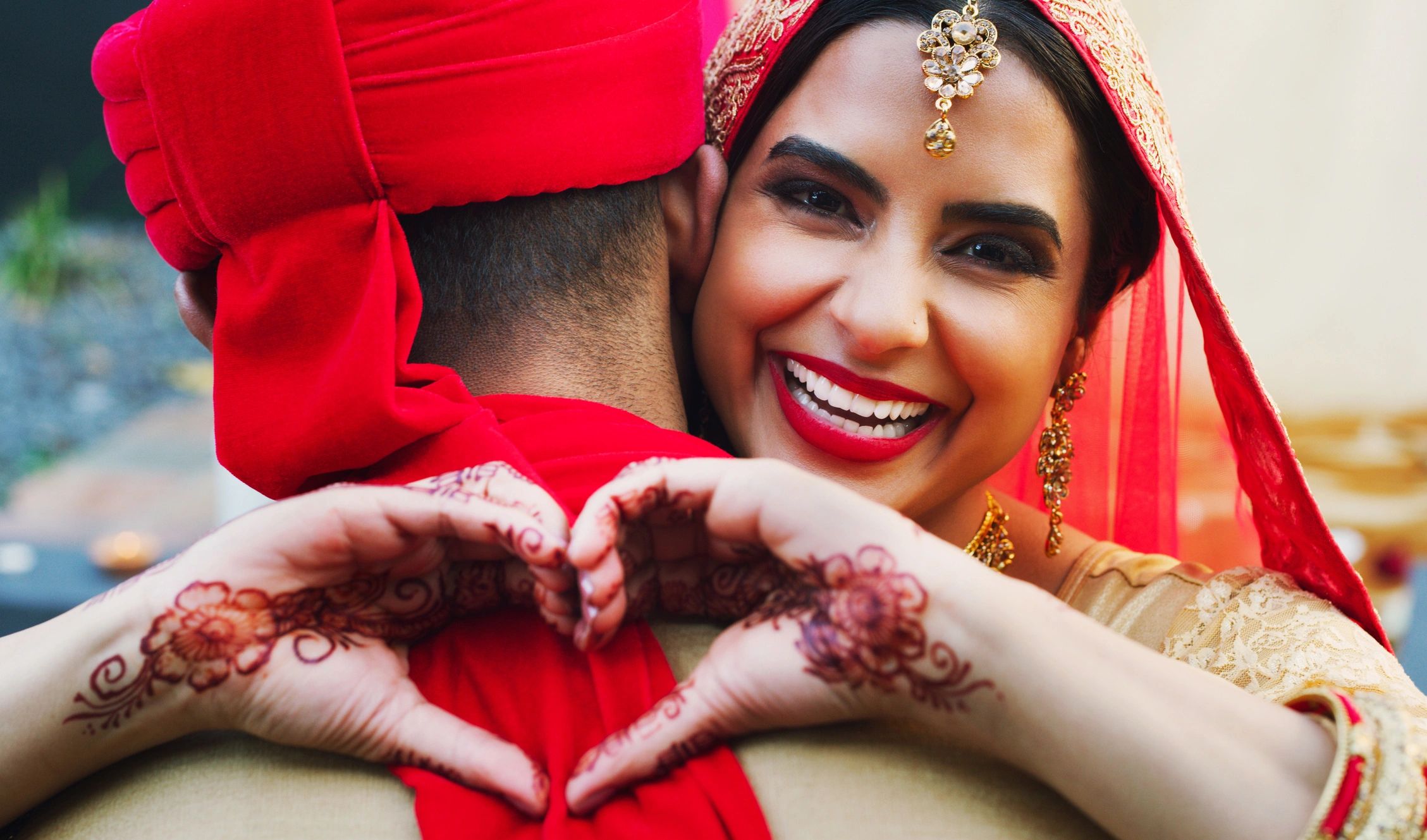 Bride embracing groom on wedding day