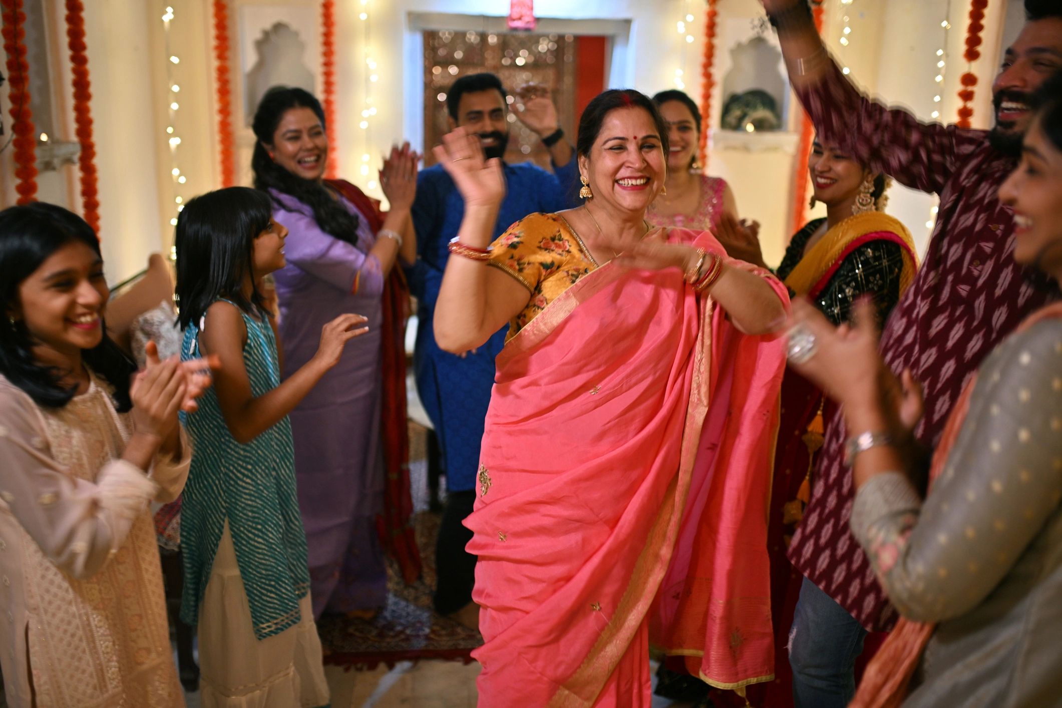 Family and friends dancing during wedding reception