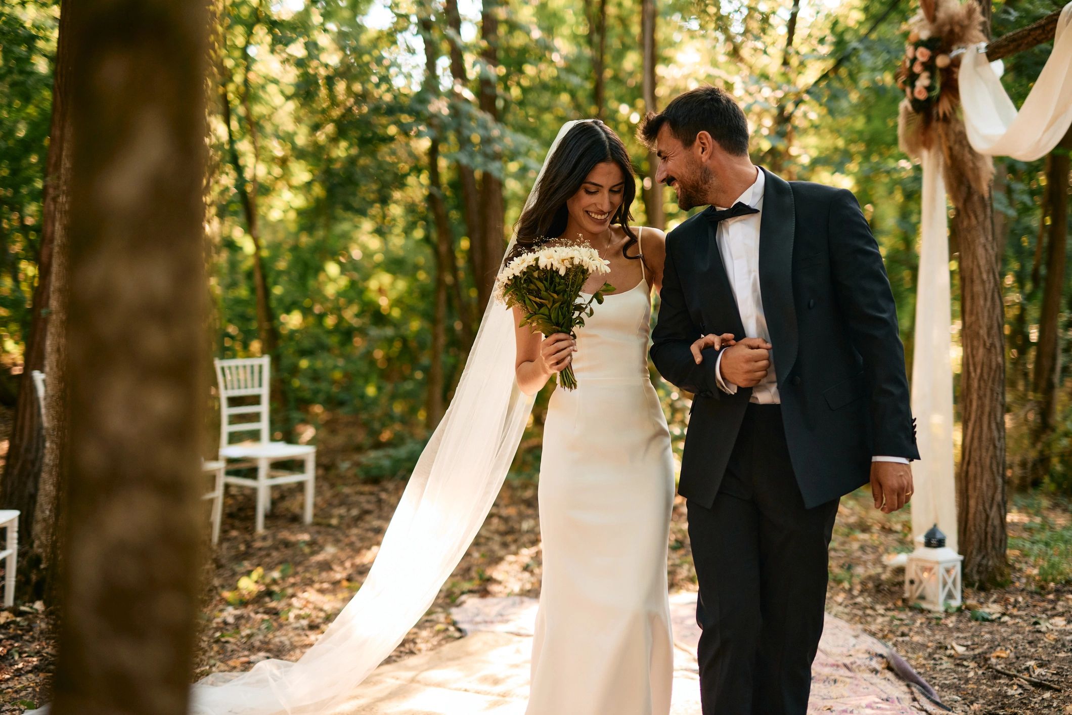 Newlywed couple walking together after their ceremony